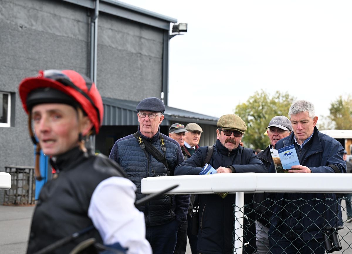 Thurles 9-October-2025Truth Be Told winning jockey Chris Hayes with racegoers Ger Sammon, Joe Hickey and Niall Tully looking on behind.Healy Racing