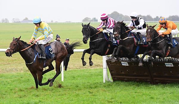 Runner-up Tatateo leads stablemate winner Tassarolo and (black and white silks) over the last