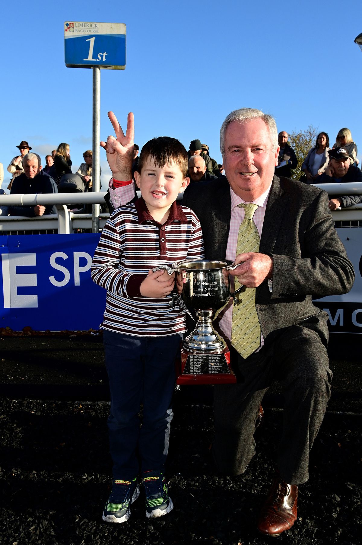 Limerick 19-October-2025French Dynamite winning trainer ERic McNamara and grandson Donagh with trophy.Healy Racing