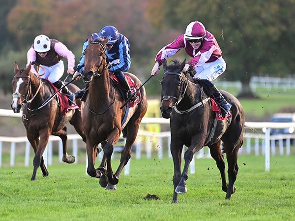 Narlita, right, gallops home for Adam Caffrey