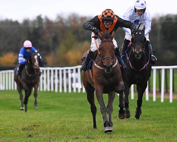 Castlefield Boy (centre) leads Well Del on the run-in