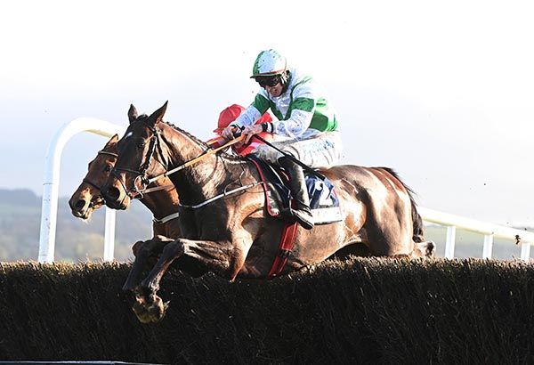 Dee Capo and Jack Kennedy clear the last