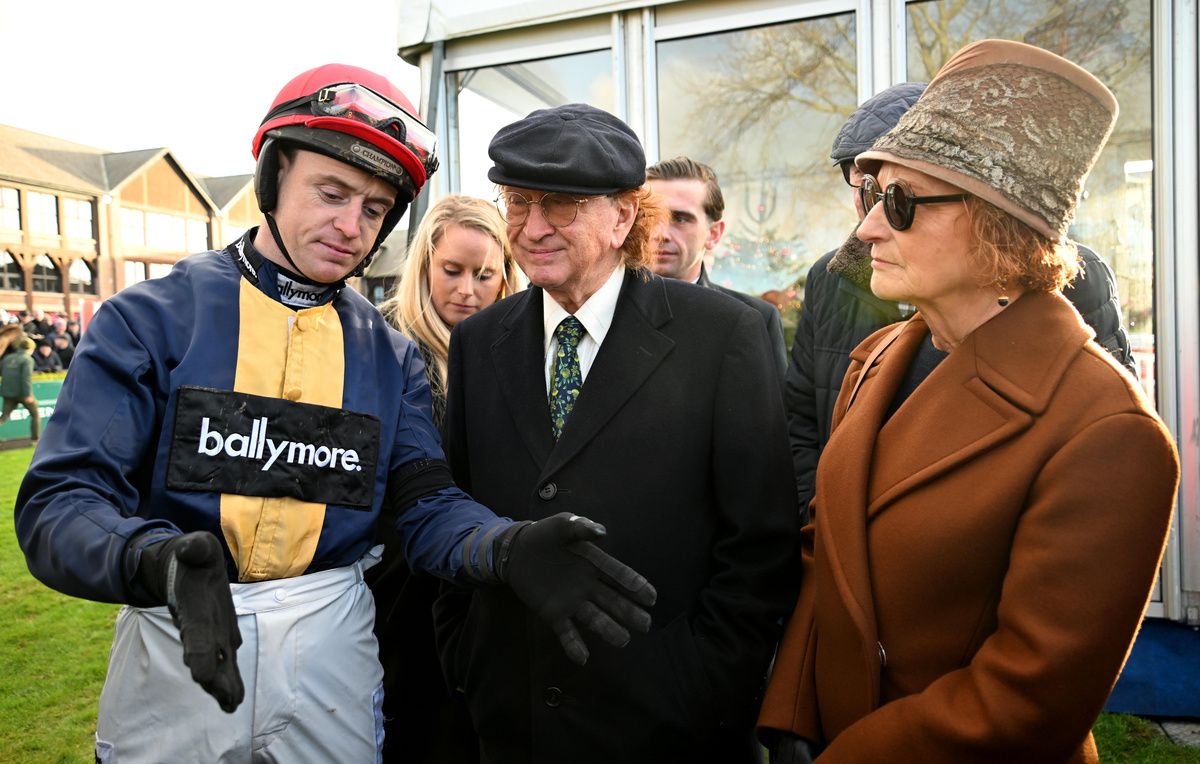 Jockey JJ Slevin talking to Fastorslow's owners Sean and Bernardine Mulryan