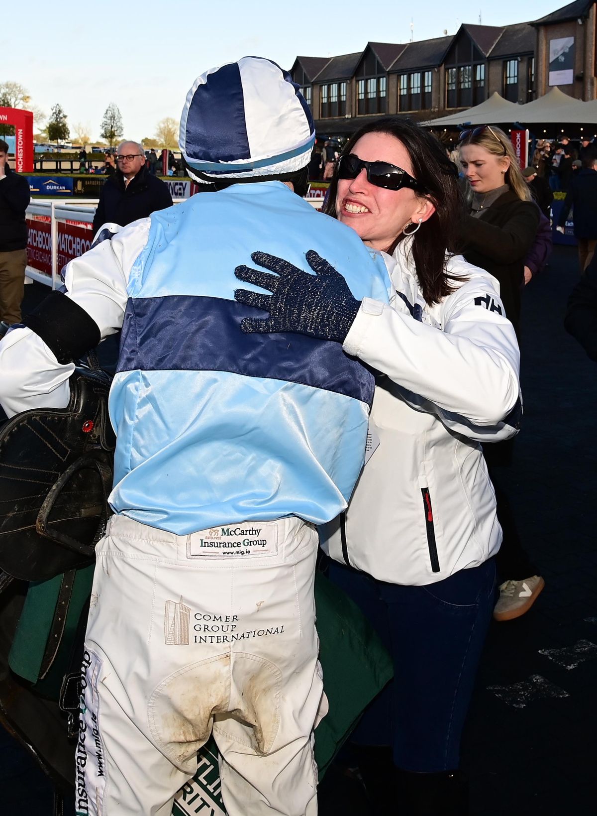 Punchestown 23-November-2025 Feet Of A Dancer owner Cathy Byrne embraces Sean O'Keeffe after win for trainer Paul Nolan.Healy Racing