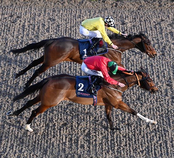 Battle Borne (far side) and Go Out go toe to toe in the closing stages