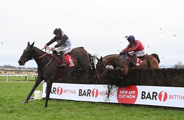 Grangeclare West (right) makes a mistake at the last before getting the better of Gerri Colombe