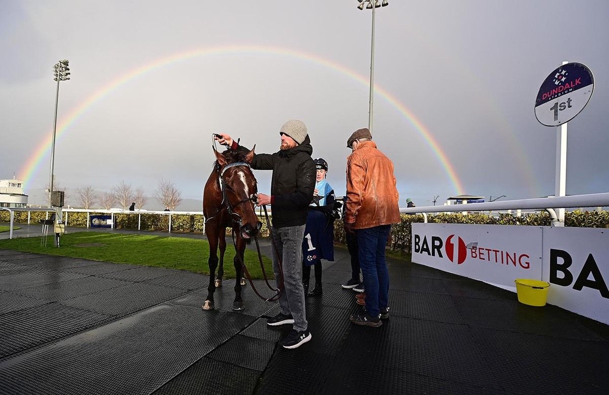 Shane Hassett leading Bishopton, who stands under a rainbow in the winner's enclosure