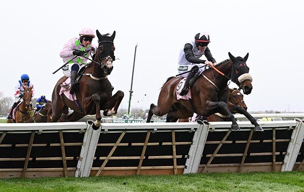 Mange Tout and Jack Kennedy (right) jumping the last