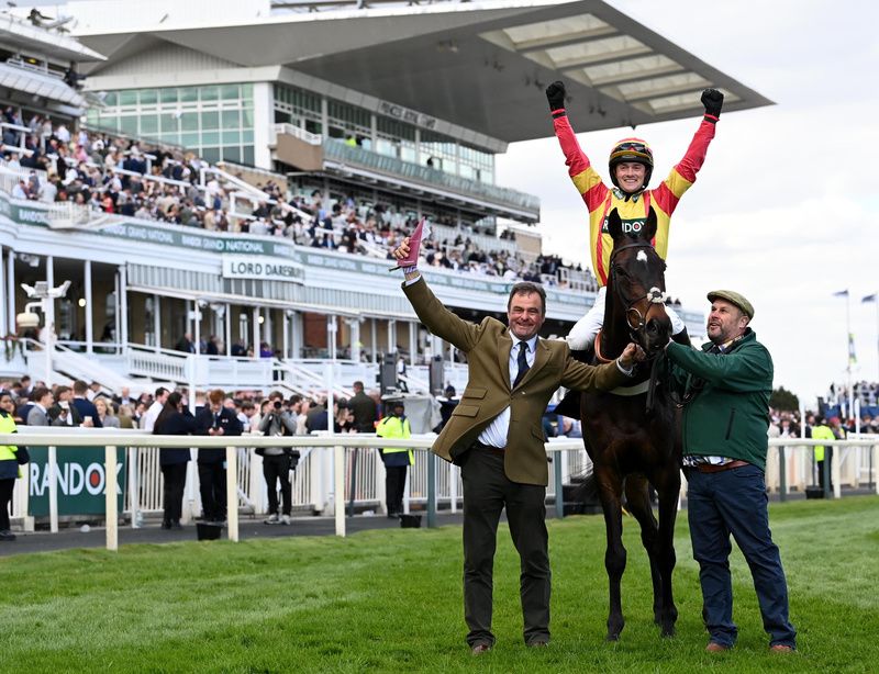 Storming George with trainer Neil King (left) and jockey Jack Quinlan after winning Aintree's Top Novices' Hurdle