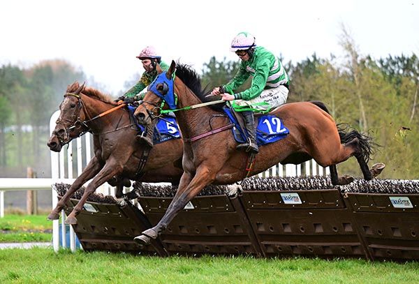 Cooltubrid Eva, near side, jumps to the front on the run-in