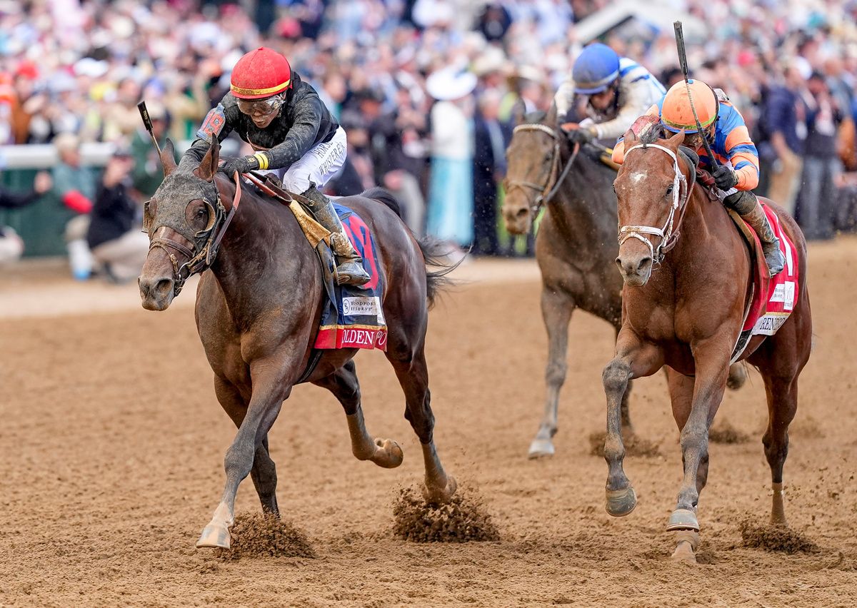Golden Tempo and Jose Ortiz, left, landing the Kentucky Derby