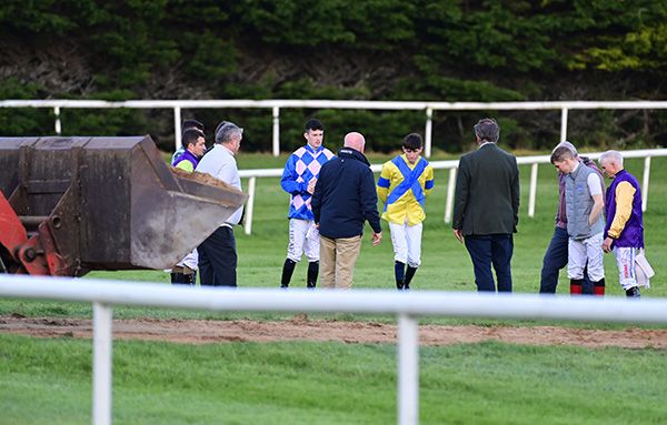 Jockeys and officials inspecting the track at Gowran