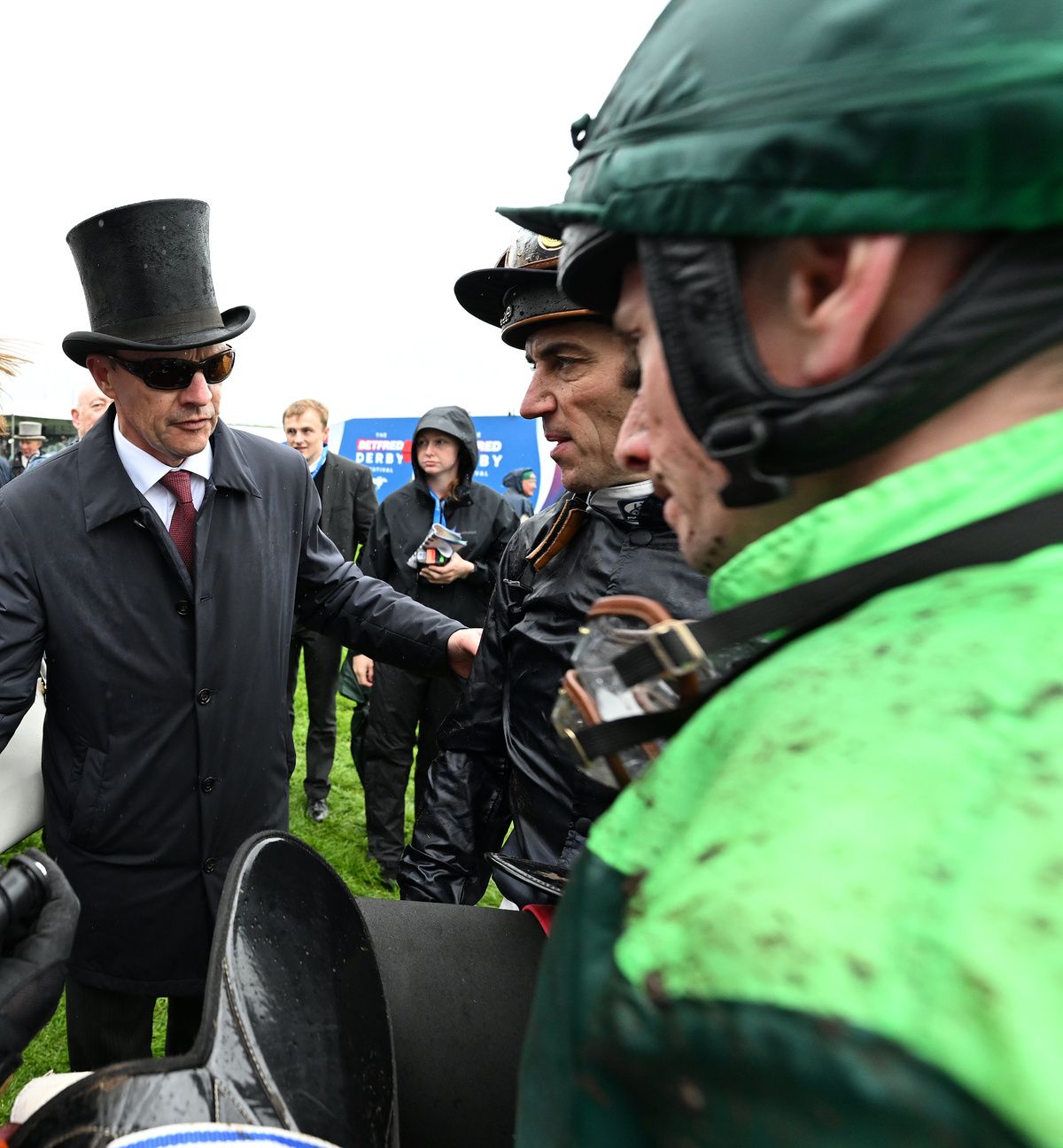 Aidan O Brien with Benvenuto Cellini jockey Ryan Moore and Christophe Soumillon after the Derby 