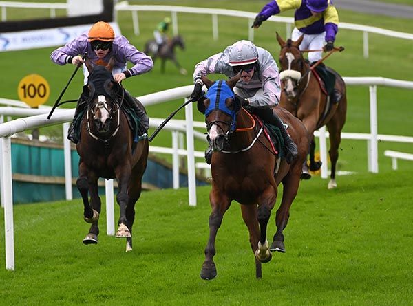 Cozone and James Smith race past Arcland to score at Downpatrick this afternoon