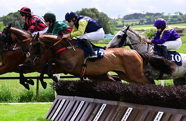 Jack Sutton and Joya Del Mar (yellow sleeves) on their way to winning at Downpatrick today