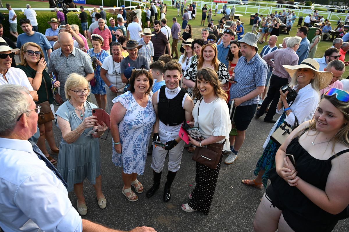 Killarney 14-July-2026Five time English Champion Jockey Oisin Murphy pictured with racegoers after he rode 2 winners on the evening.Healy Racing