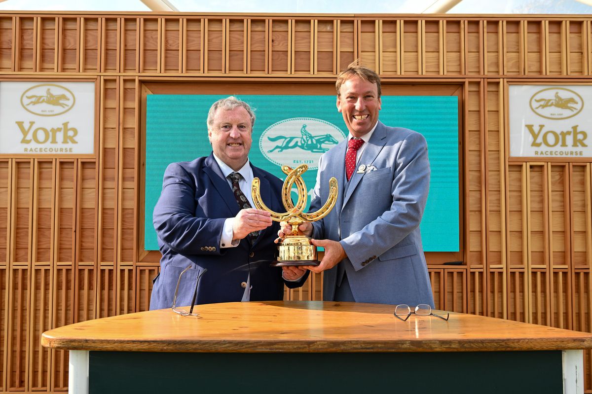 Brian Kavanagh and William Derby with the Golden Horseshoe Challenge Trophy