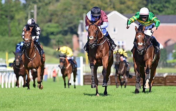 Nicky Larson (centre) sees off the challenge of Nod Of Approval (right)
